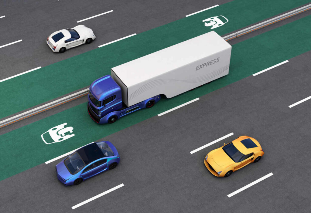 Overhead view of a driverless 18-wheeler truck on a dedicated highway lane with autonomous vehicle symbols, illustrating the complex liability questions arising from their potential crashes in Texas.