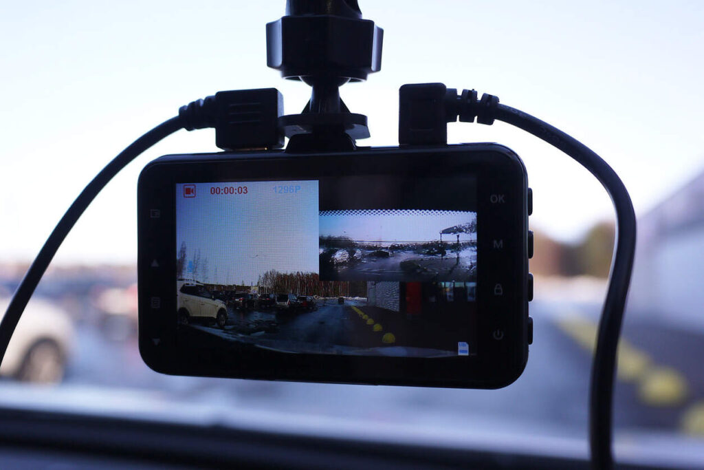 A car's dashboard camera with multiple views of the road, illustrating the use of AI dash cams as powerful evidence in auto accident cases.